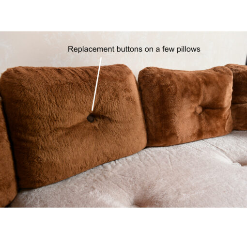 Pillows on vintage 1970s curved sofa sectional