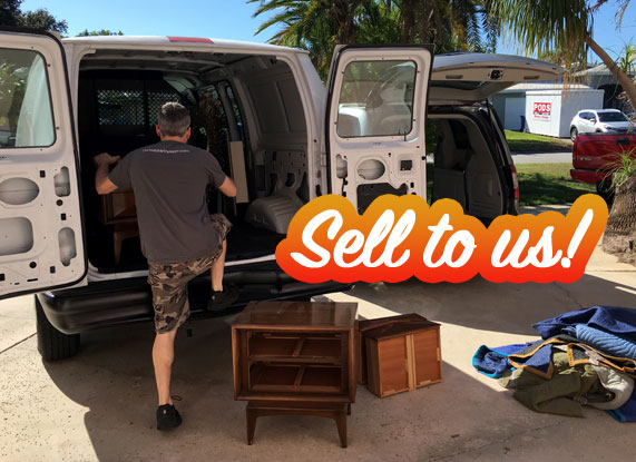 Loading mid-century modern furniture into a van