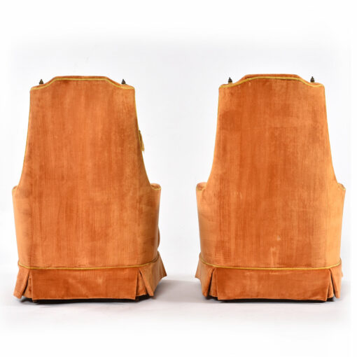 Back view of pair of vintage 1970s McAfee orange tufted armchairs