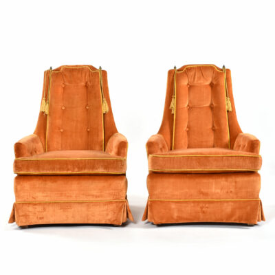 Orange mid-century modern lounge chairs by McAfee