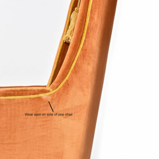 Wear spot on the side of McAfee orange vintage armchair