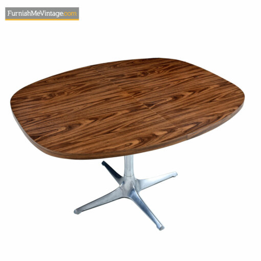 The Chromcraft Sculpta dining table accompanies the Unicorn Star Trek chairs designed by Vladimir Kagan.