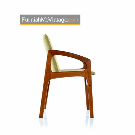 Set of four Danish modern solid teak arm chairs outfitted in new green upholstery. These chairs are vintage 1980s and feature a sleek minimalist design.