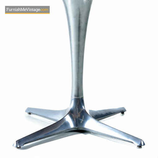 The Chromcraft Sculpta dining table accompanies the Unicorn Star Trek chairs designed by Vladimir Kagan.