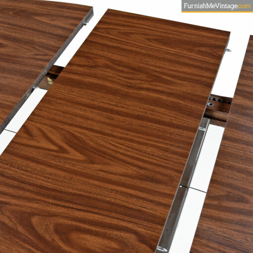 The Chromcraft Sculpta dining table accompanies the Unicorn Star Trek chairs designed by Vladimir Kagan.