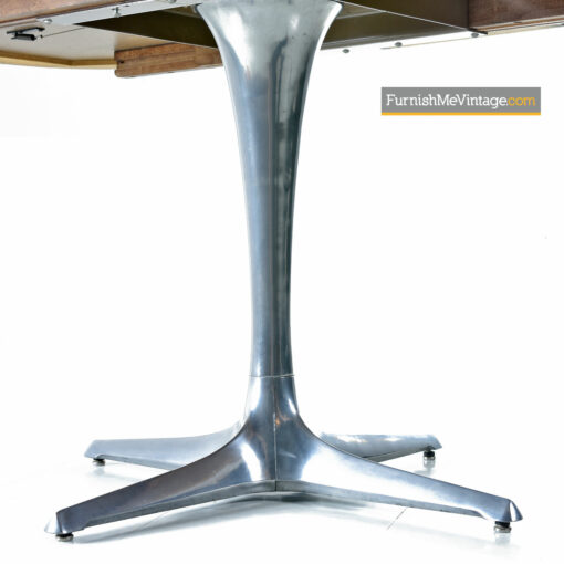 The Chromcraft Sculpta dining table accompanies the Unicorn Star Trek chairs designed by Vladimir Kagan.