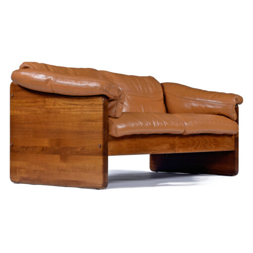 Profile view with solid teak staved wood on leather loveseat sofa