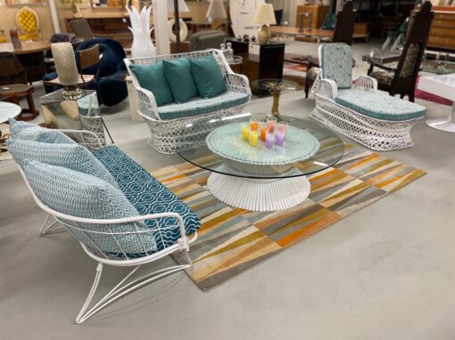 Mid-century modern spun fiberglass outdoor furniture with McGuire rattan coffee table