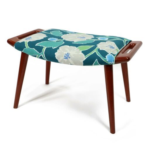Iconic mid-century modern Papa Bear Chairs by Hans Wegner. The set comes with an ottoman as pictured and features floral teal, green and white fabric.