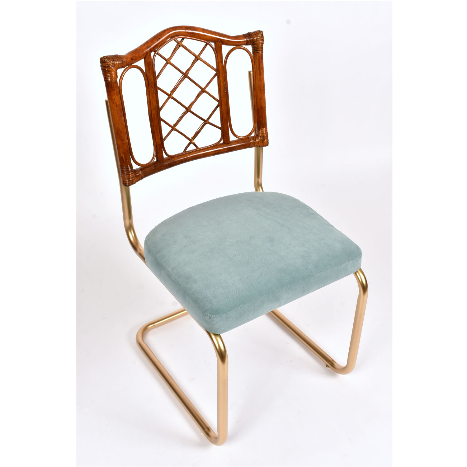 Restored vintage 1970s Bohemian rattan back dining chairs with matte gold cantilever steel frames and new blue velvet seats. Restored vintage 1970s Bohemian rattan back dining chairs with matte gold cantilever steel frames and new blue velvet seats.