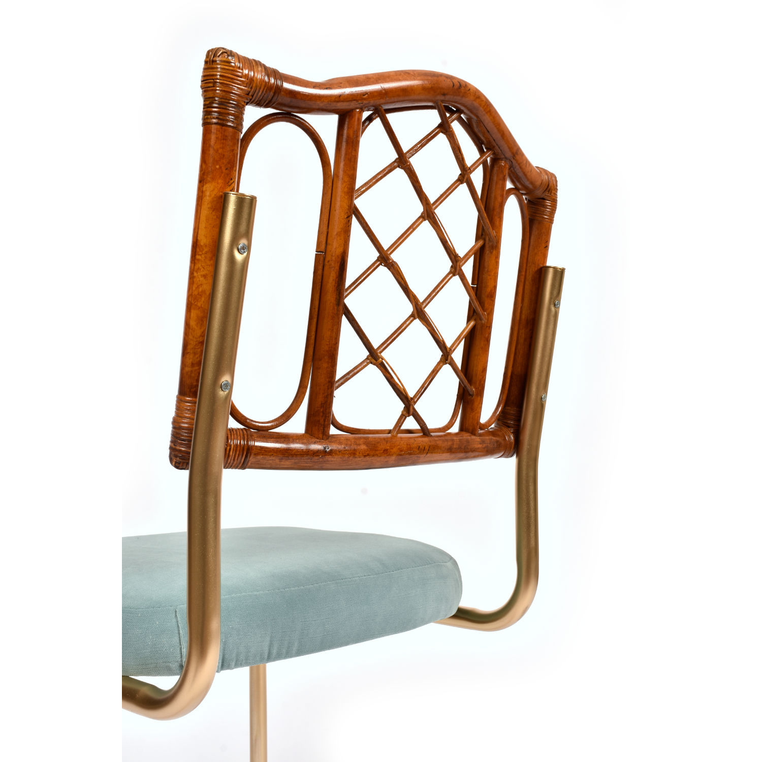 Restored vintage 1970s Bohemian rattan back dining chairs with matte gold cantilever steel frames and new blue velvet seats. Restored vintage 1970s Bohemian rattan back dining chairs with matte gold cantilever steel frames and new blue velvet seats.