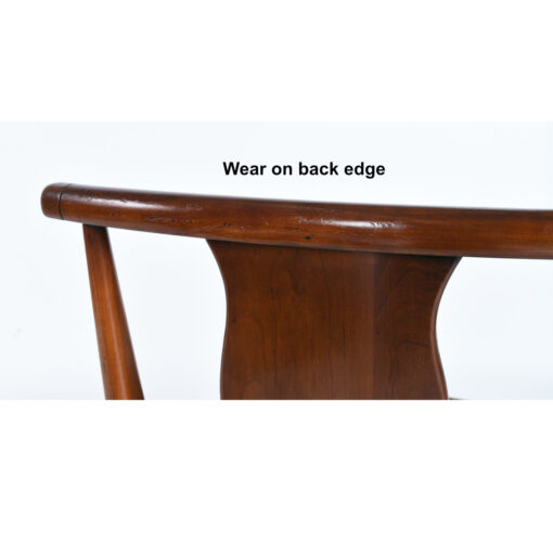 Wear along the back edge of chair
