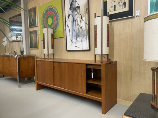 Danish teak credenza with sliding doors and cylindrical lamps