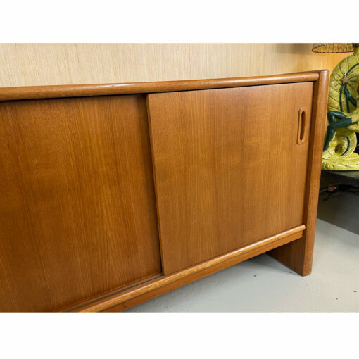 Sliding doors on Danish teak credenza