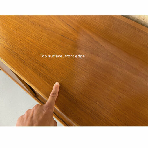 Blemish on top of Danish Modern teak credenza with sliding doors