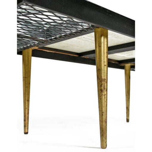 Gold colored brass legs on black coffee table