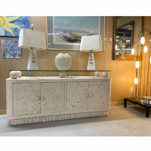White alabaster stone lamps on tessellated stone credenza