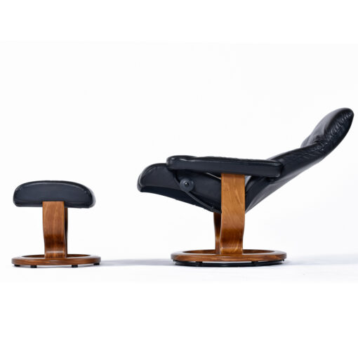 Ekornes Consul black leather recliner chair with ottoman