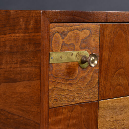 Campaign style brass hardware on John Stuart checkered dresser