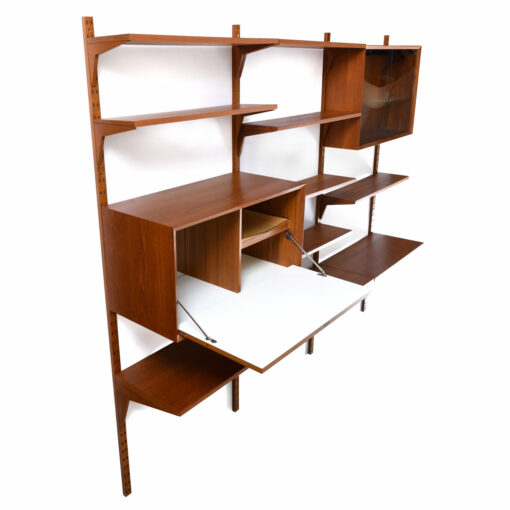 Wall mounted Danish teak shelving system by CADO