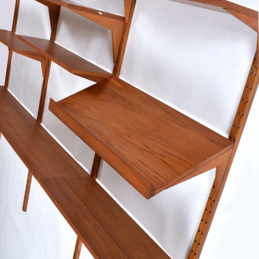 Magazine rack shelf on CADO wall system