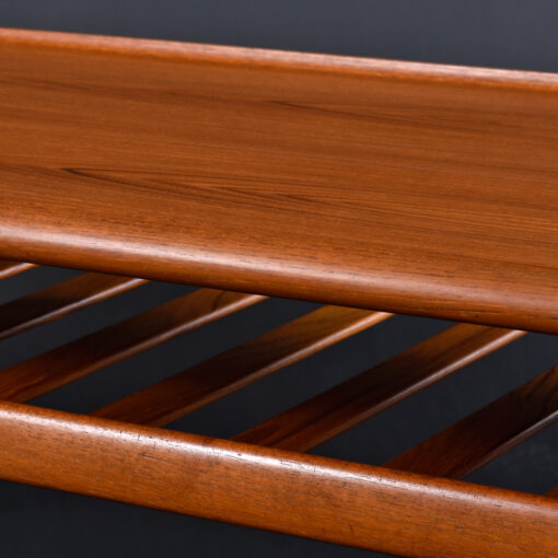 Lower magazine shelf on Grete Jalk coffee table