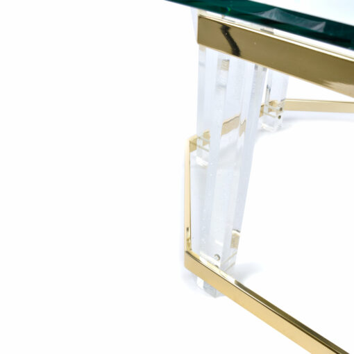 Close up on Lucite pillars and metallic gold spanners