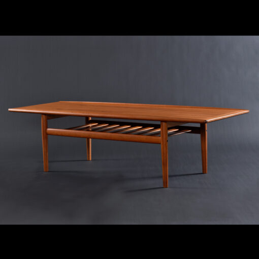 Danish teak coffee table with magazine rack by Grete Jalk