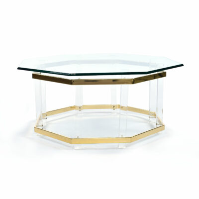 Profile view of clear acrylic and brass coffee table