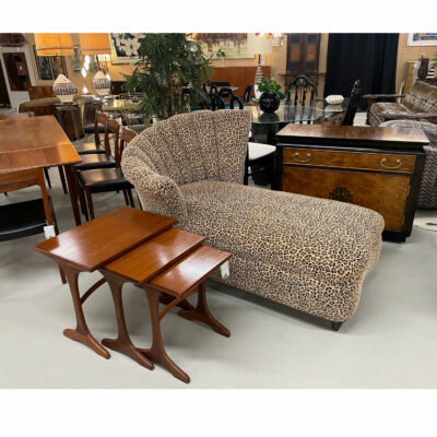 Leopard print chaise lounge with teak nesting tables and Asian bar cart