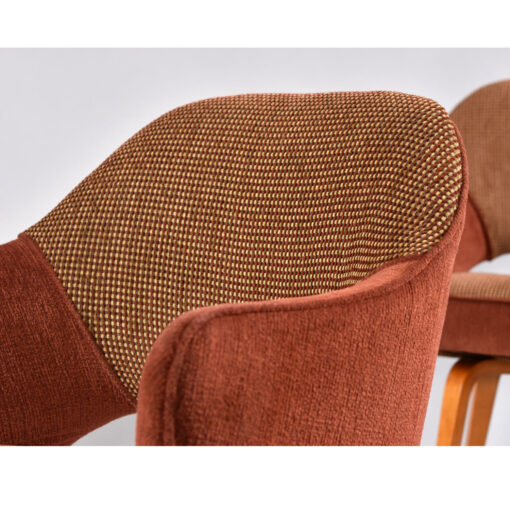 Woven fabric and solid mauve color fabric on Saarinen executive chairs