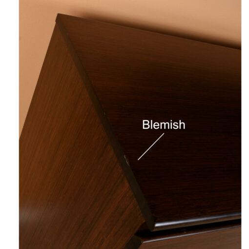 Abrasion on top left edge of long dresser