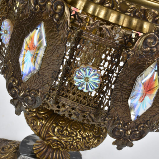 Elaborate stamped metal lamp by Loevsky & Loevsky