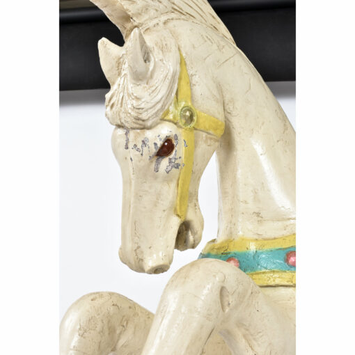 Paint loss on face of C.W. Parker carousel horse