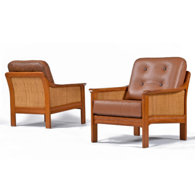 Leather arm chairs made of solid teak wood with caned sides
