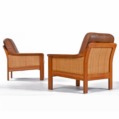 Caned leather armchairs with solid teak wood frames