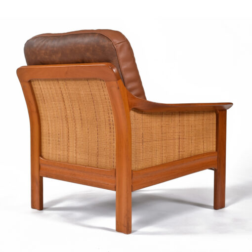 Caned back and sides of teak armchair
