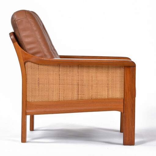 Caned armchair with leather upholstery