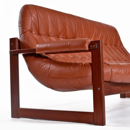 Side view of Brazilian Modern rosewood and Leather sofa by Percival Lafer