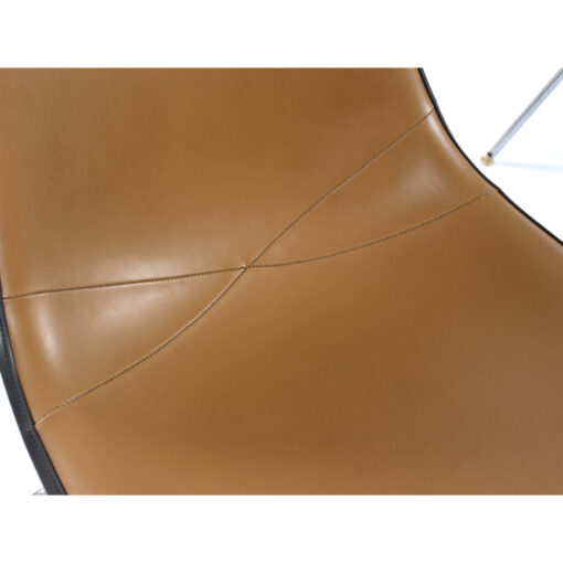 Close up on the signature stitching on the Eames for Herman Miller Naugahyde seat pad