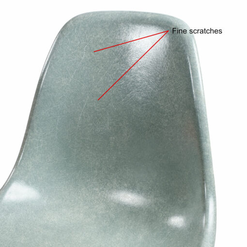 Fine scratches on light blue Eames fiberglass shell chair