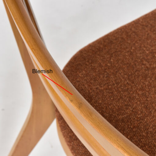 Blemish on top edge of one of the side chairs