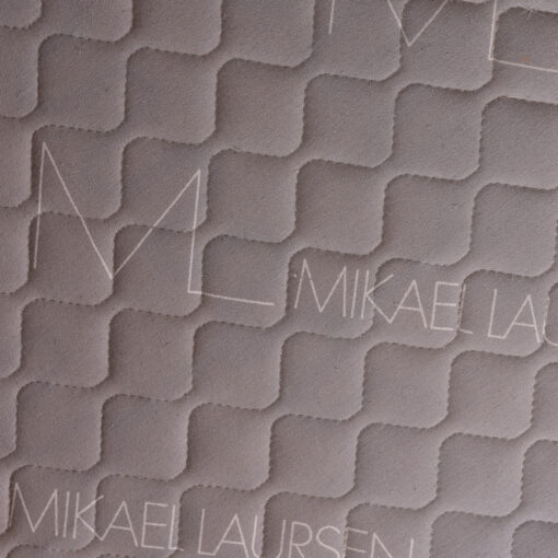 Mikael Laursen name on love seat decking