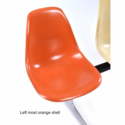 Left most orange Eames fiberglass shell chair
