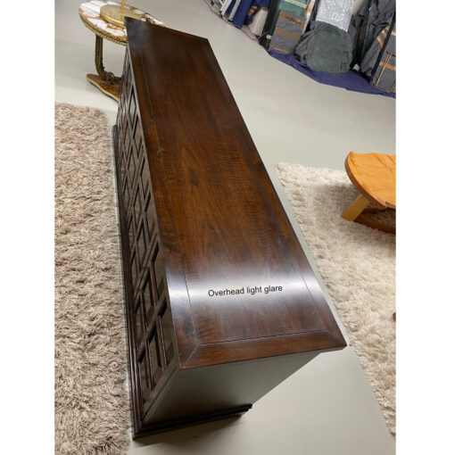 Top of Widdicomb credenza, white area is light glare from overhead lights