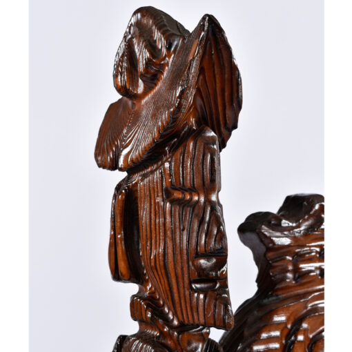 Carved conquistador figures atop Witco tiki chairs