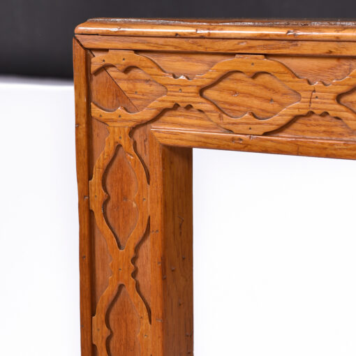Carved pattern bordering Henredon burl dining table