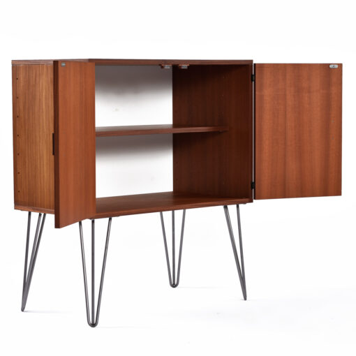Lots of storage space in Mid-Century Modern cabinet. Can be dry bar, TV stand or record cabinet