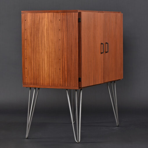 Lots of storage space in Mid-Century Modern cabinet. Can be dry bar, TV stand, stereo cabinet, or record cabinet